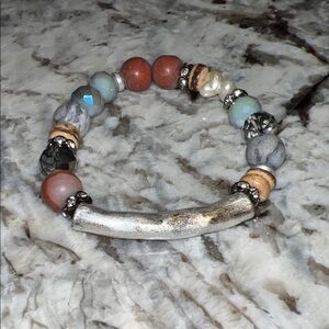 Boho bracelet with earthy beads and silver statement